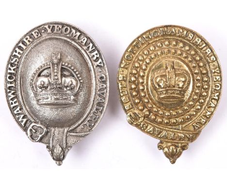 A post 1902 white metal bit boss of the Warwickshire Yeomanry Cavalry; and a Victorian brass bit boss of the South Nottingham