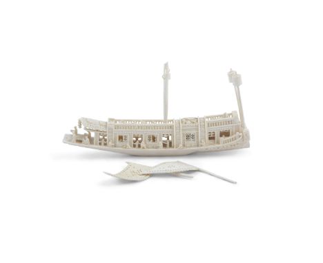 A FINE CHINESE CARVED IVORY LONG BOAT, Canton, mid 19th century, delicately carved with figures standing by the edge, with pi