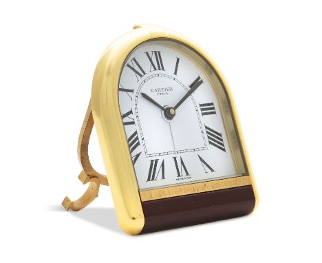 A DESK CLOCK BY CARTIER, of quartz movement with Roman numerals and black sword hands, within a gold plated and burgundy colo