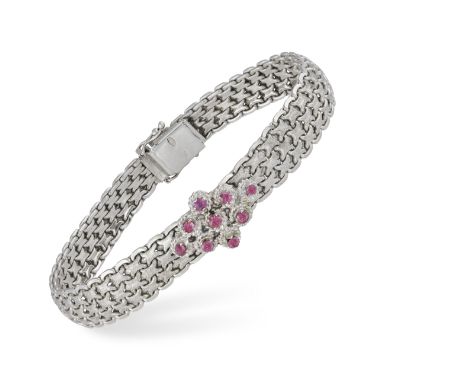 A GOLD AND RUBY BRACELET, the articulated 'X' link strap set at the centre with circular-cut rubies, mounted in 18K gold, len