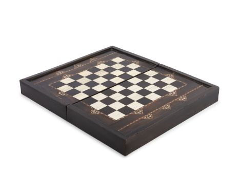 A NASRID EBONY AND IVORY INLAID FOLDOVER GAMES BOX, Spain, probably 15th Century, the exterior inlaid with chess board contai