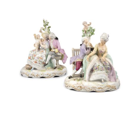 A PAIR OF DRESDEN PORCELAIN FIGURAL TABLE LAMPS, modelled as figures in 18th century attire, one playing with a baby, seated 