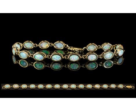 Ladies Attractive 9ct Gold Opal Set Line Bracelet, Set with 15 Opals of Excellent Colours. Est Weight 7.5 cts. Marked 9.375. 