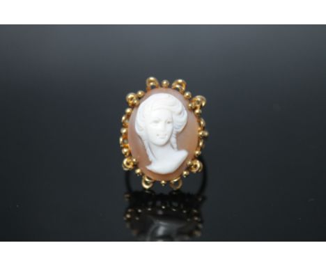 A 9 CARAT YELLOW GOLD CAMEO RING, the cameo measuring 20 mm by 15 mm, ring size O