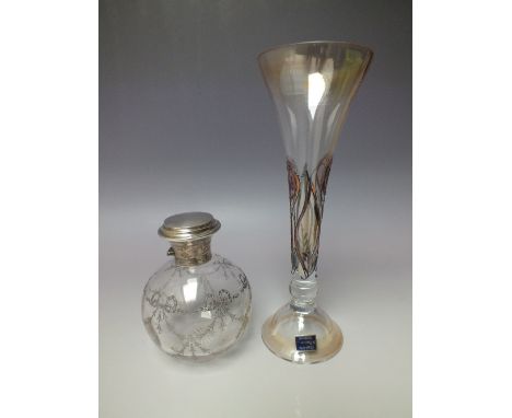 A HALLMARKED SILVER LIDDED GLOBE SHAPED GLASS PERFUME BOTTLE, the clear glass body with etched swags and bow decoration, H 13