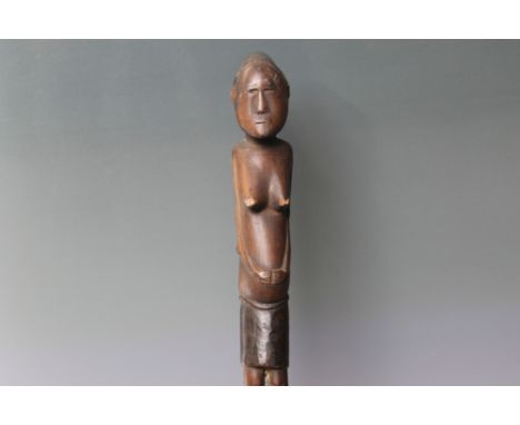 SOUTH SEAS - POSSIBLY FIJI, a carved hardwood stick featuring a female figure carring a child upon her back, L 51 cm