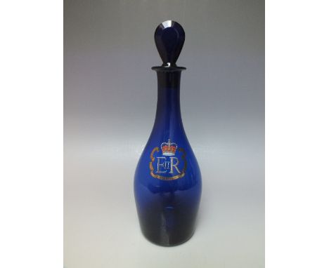 A BRISTOL BLUE GLASS DECANTER, with gilt EIIR Silver Jubilee crest to the front, H 29.5 cm (inc stopper)