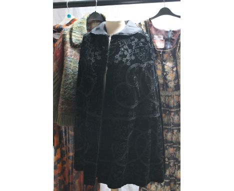 A SELECTION OF LADIES VINTAGE CLOTHING, comprising an early 20th century mourning cape, with corded embellishment, fully line