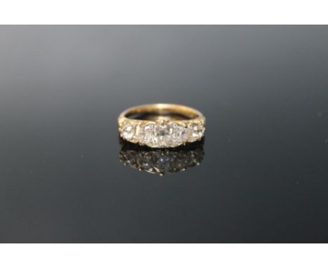 A FIVE STONE DIAMOND RING, set with five graduating old cut diamonds totalling approx 1.90 carats, ring size O