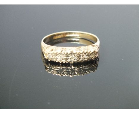 A 9 CARAT YELLOW GOLD FIVE STONE DIAMOND RING, set with brilliant cut diamonds totalling 0.05 carat, ring size P 1/2