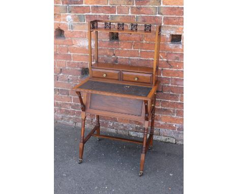 ATTRIBUTED TO LIBERTY'S - A LADIES MAHOGANY LATE 19TH CENTURY WRITING DESK, the upper section with a pierced gallery shelf ab