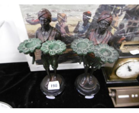 A PAIR OF BLACKAMORE CANDLESTICKS, PAINTED BRONZE IN THE STYLE OF BERGMAN
