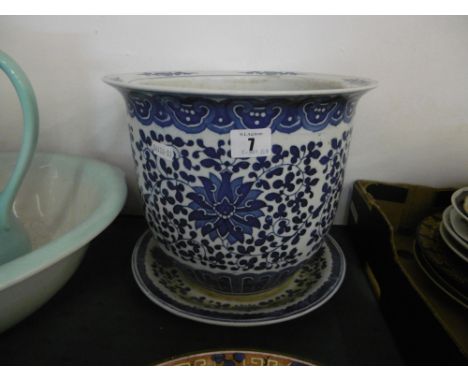 BLUE AND WHITE PLANTER ON STAND
