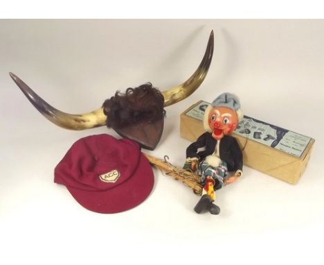 R.N.L.I. CHARITY LOT.
A pair of mounted horns, a Pelham Puppet, Macboozle & a sporting cap.