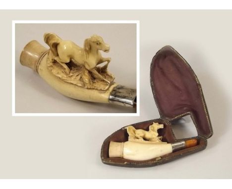 MEERSCHAUM.
A carved Meerschaum pipe with amber mouthpiece, in fitted case.