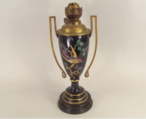OIL LAMP.
A 19th century metal mounted, enamelled ceramic oil lamp. Height 48cm.