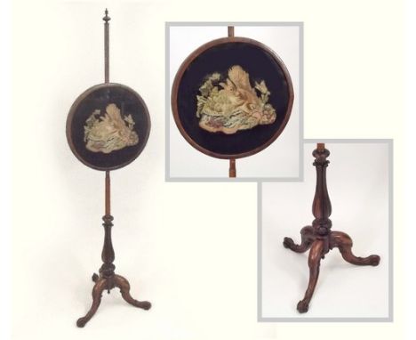 POLE SCREEN.
A Victorian rosewood pole screen, with raised tapestry panel. Height 151cm.