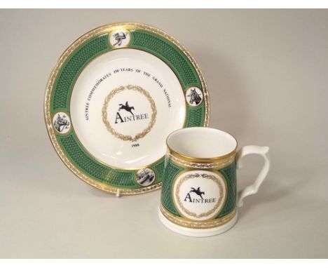 SPODE.
A Spode bone china, 1988 Aintree commemorative Grand National plate, showing Red Rum & Aldaniti & a matching mug.