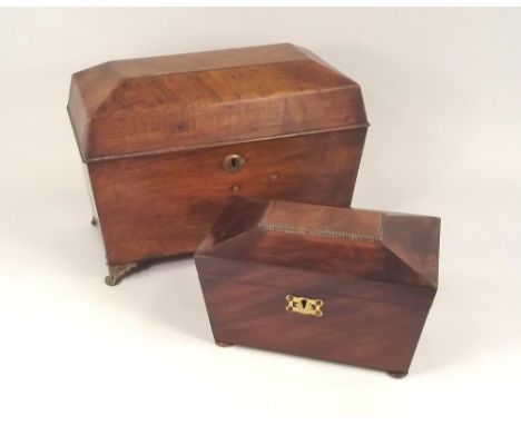 BOXES.
A mahogany tea caddy, 22 x 12cm & a large sarcophagus box.