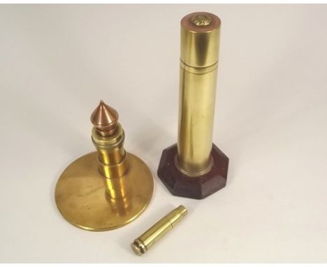 TRENCH ART LIGHTERS.
Three trench art cigarette lighters, comprising two table lighters, one with Grenadier Guards button app