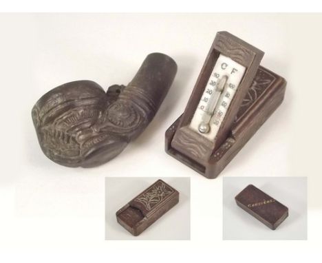 THERMOMETER ETC.
A Swiss miniature thermometer in carved case, a souvenir from Chesieres, length 7.5cm & a stone pottery pipe