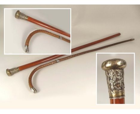 WALKING CANES.
A walking cane with Chinese silver top & a silver mounted Congo cane walking stick.
