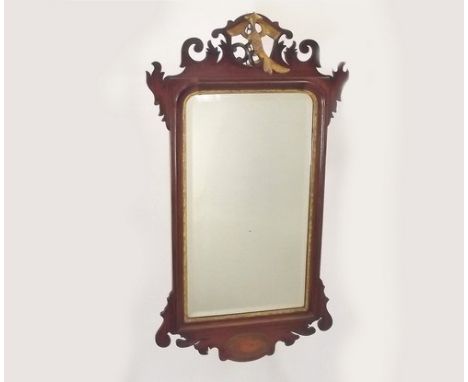 WALNUT MIRROR.
A 19th century walnut mirror with gilt eagle finial.
Height 90cm.