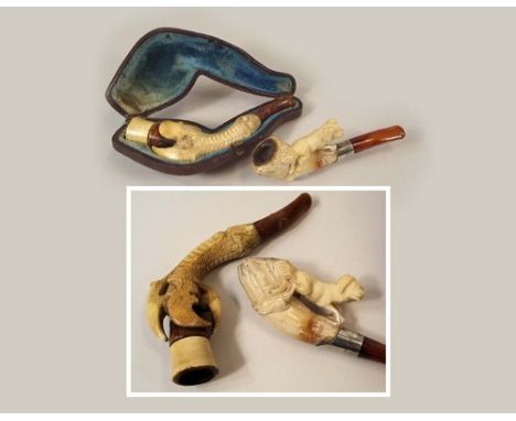 MEERSCHAUM.
A carved Meerschaum pipe, in fitted case & a dog carved Meerschaum pipe.