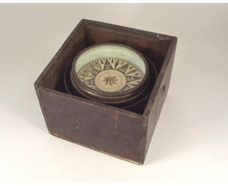COMPASS.
A brass gimbal compass by Dring & Fage.
Diameter 14cm.