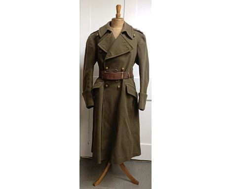 A military coat, a leather belt and assorted military hats (box)  Provenance:&nbsp; A single owner collection, from the studi