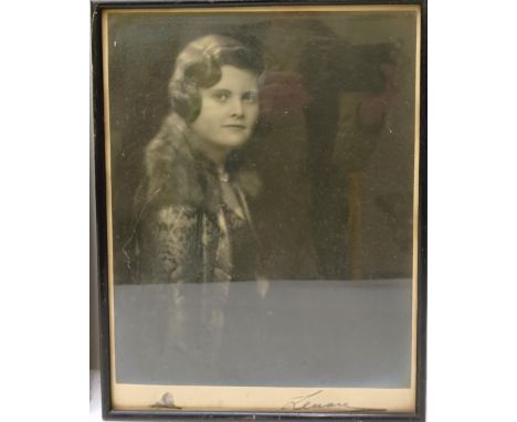 A vintage photograph of a lady in a fur coat, facsimile signed, 35 x 26 cm, and two others similar (3)  Provenance:&nbsp; A s