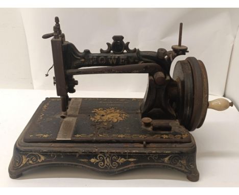 A Howe table top sewing machine, 32 cm wide  Provenance:&nbsp; A single owner collection, from the studio of a seamstress