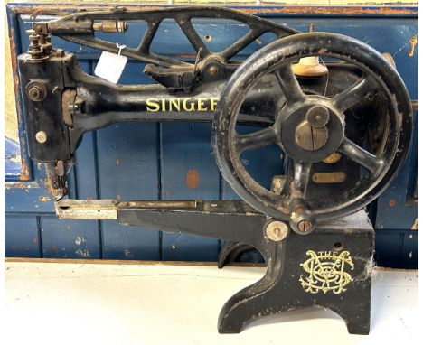 An industrial Singer sewing machine, 65 cm wide Provenance:&nbsp; A single owner collection, from the studio of a seamstress