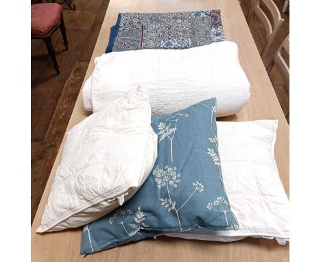 A pair of Vanessa Arbuthnot cow parsley cornflower coloured fabric cushions, a Habitat King size white bedspread with two mat