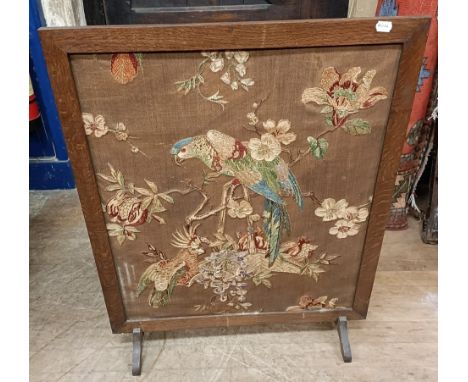 An embroidered firescreen, decorted a parrot, 95 x 77, and another, 106 x 68 cm (2)