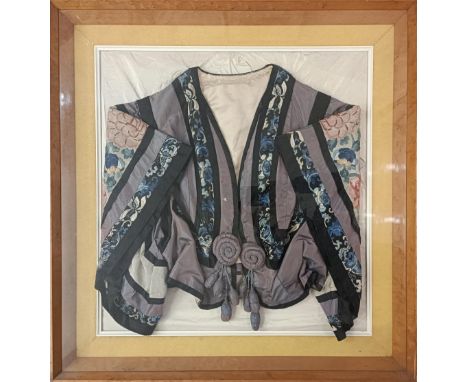 A Chinese silk embroidered jacket, decorated flowers, 53 x 50 cm, in a birdseye maple box frame Provenance:&nbsp; A single ow