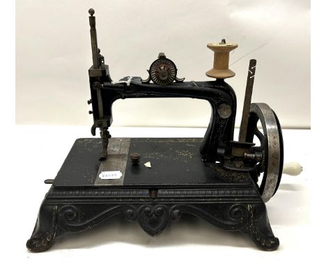 A 19th century table top sewing machine, 31 cm wide Provenance:&nbsp; A single owner collection, from the studio of a seamstr