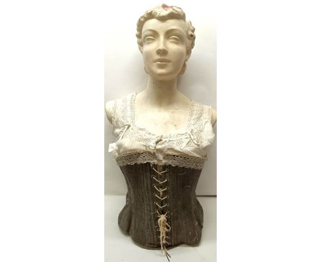 A plaster female bust, shop display size, with a lace trimmed corset, 75 cm high Provenance:&nbsp; A single owner collection,