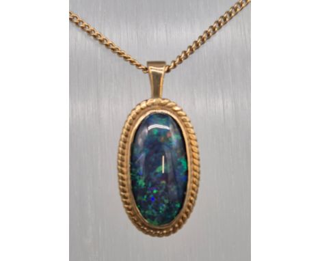 9ct yellow gold chain together with a 9ct yellow gold and fire opal gem stone pendant. 5.73grams 
