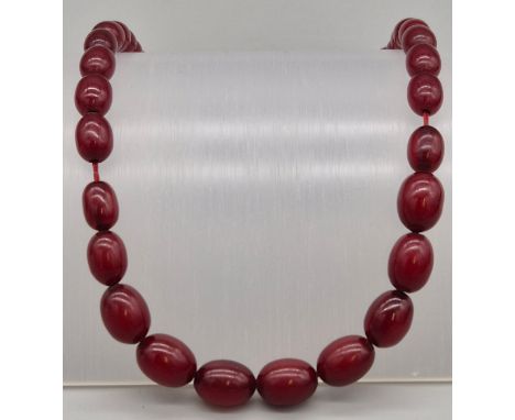Vintage Cherry Amber Bakelite necklace. Fitted with a 9ct gold clasp. 
