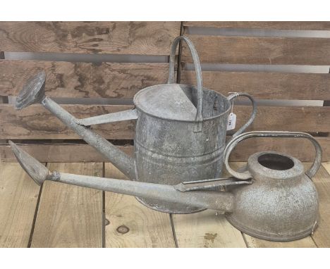 Two vintage 6 pint and 2 gallon watering cans. 