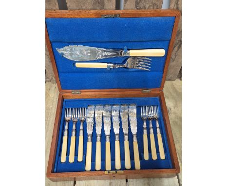 Victorian Walnut canteen chest containing Fish knives and fork. 