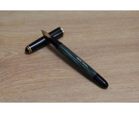 A Pelikan 400NN piston fill fountain pen in green striped with black cap having Pelikan 14C 585 nib. Engraved