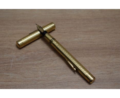 A Mabie Todd Self Filling lever fill fountain pen in yellow metal in engine turned chevron design having Swan 2 14ct nib
