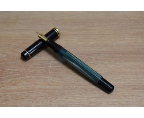 A Pelikan M200 piston fill fountain pen in green marble with black cap having Pelikan EF nib.