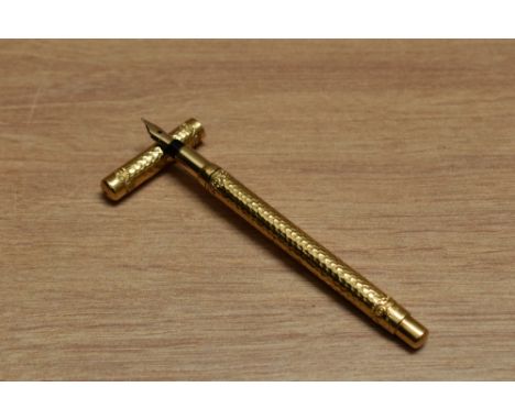 A Mabie Todd &amp; Co Swan 1 eye dropper fountain pen in hammered yellow metal having Swan 1 K 14C 585 nib.