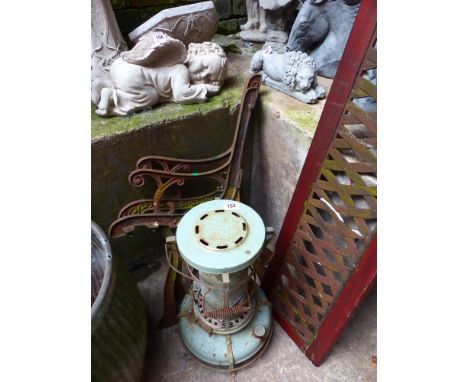 Pair of cast metal bench ends, garden bench back and a vintage oil heater