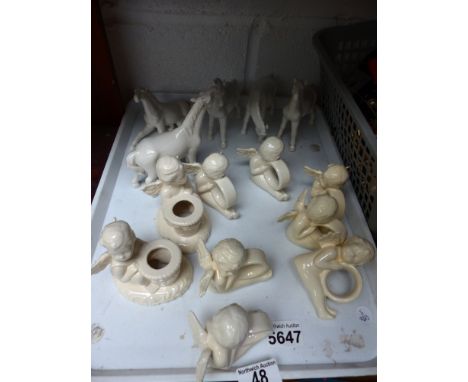 Box of mixed ceramic horses and cherubs