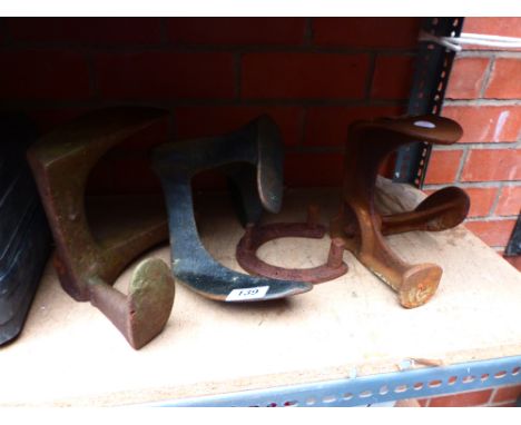 Four vintage cast metal shoe lasts
