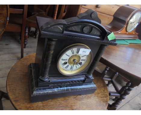 Victorian wooden mantel clock having marble effect finish with enamelled dial and Roman Numerals striking on the hour